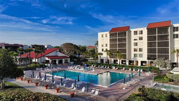a view of a swimming pool with a lounge chair