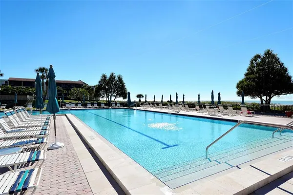 a view of a small pool with a yard