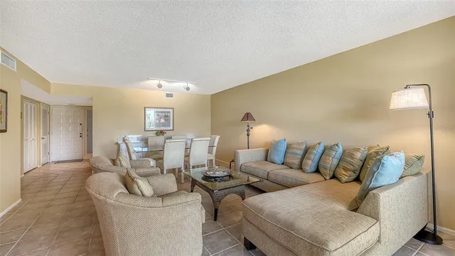a view of a chairs and table in a balcony