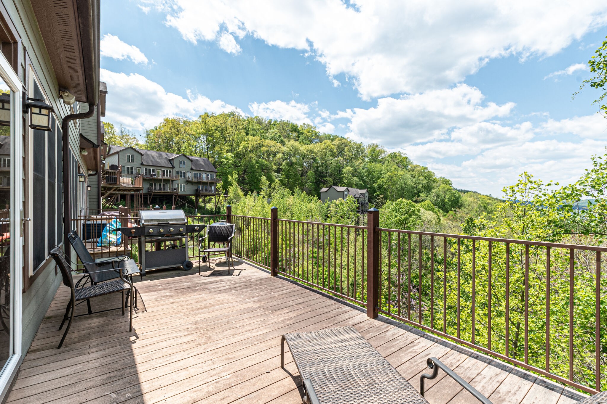 115 Vista Pt Road, Unit 115 Silver Point, TN 38582 - Photo 26 of 50 a balcony with wooden floor table and chairs