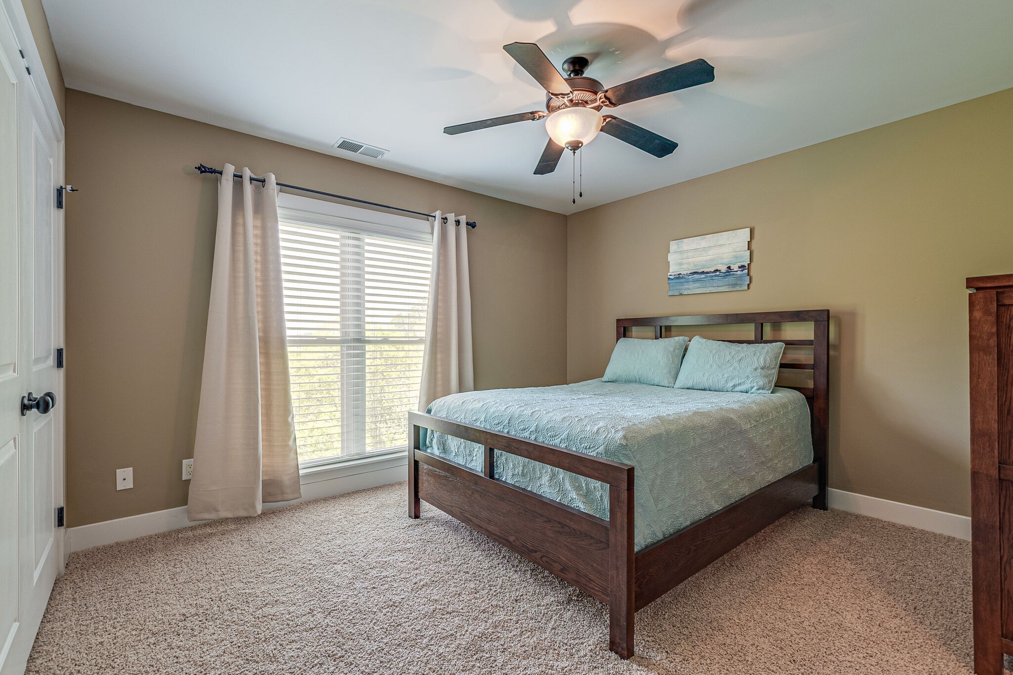 115 Vista Pt Road, Unit 115 Silver Point, TN 38582 - Photo 34 of 50 a bedroom with a large bed and a large window