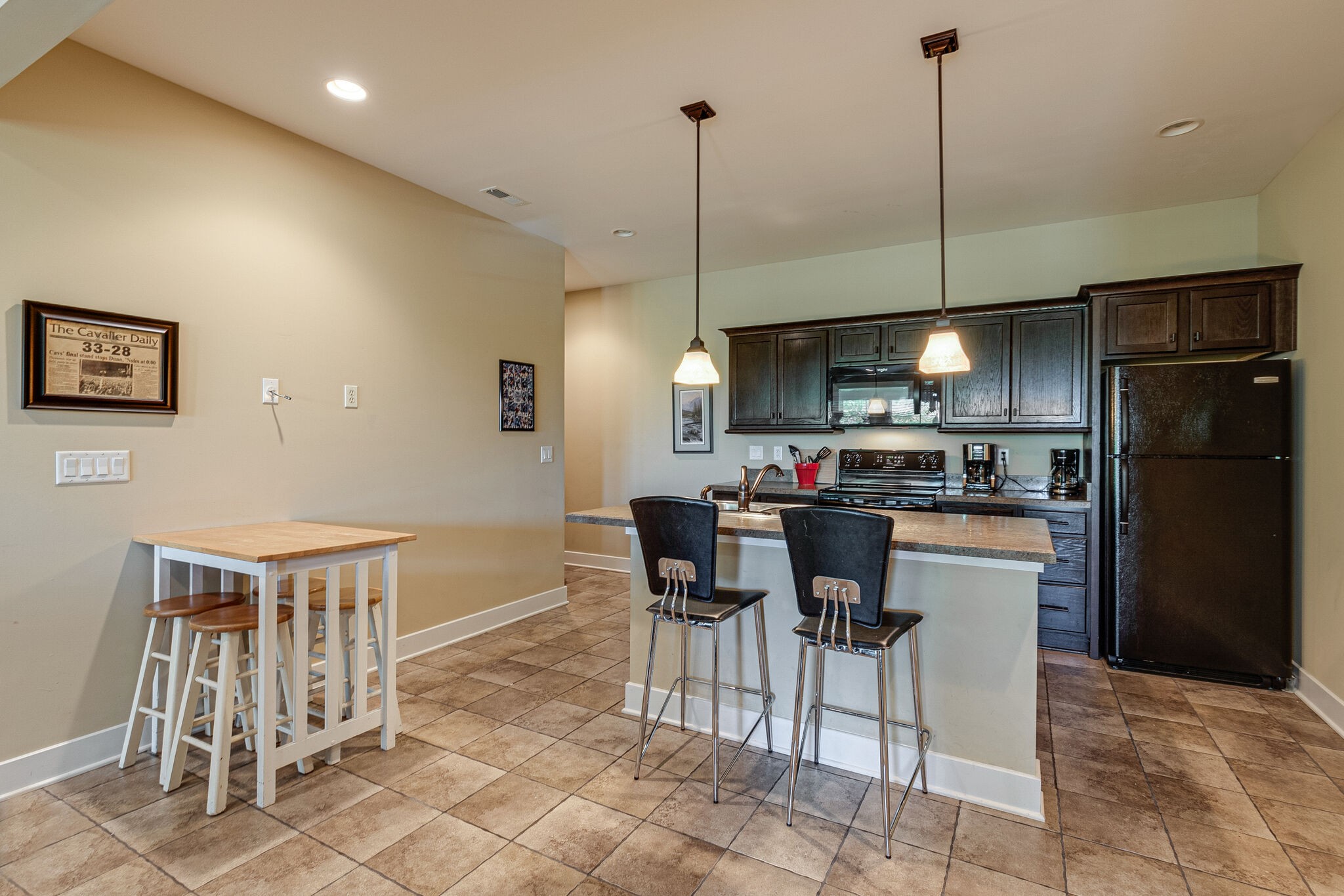115 Vista Pt Road, Unit 115 Silver Point, TN 38582 - Photo 40 of 50 a kitchen with kitchen island a dining table chairs stainless steel appliances and cabinets