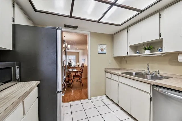 a kitchen with a sink and cabinets