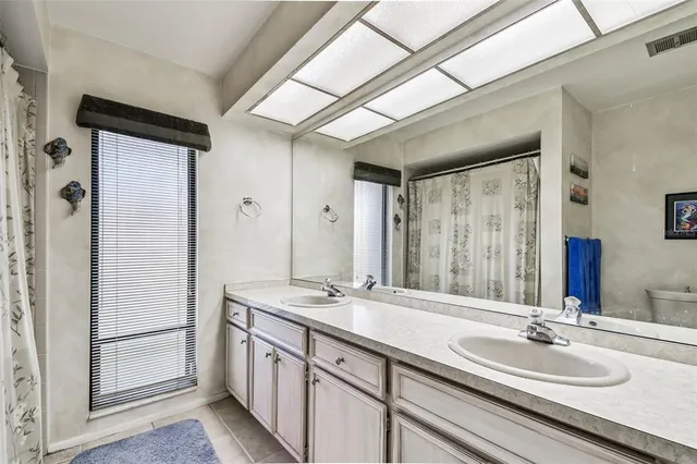 a bathroom with a shower and a tub