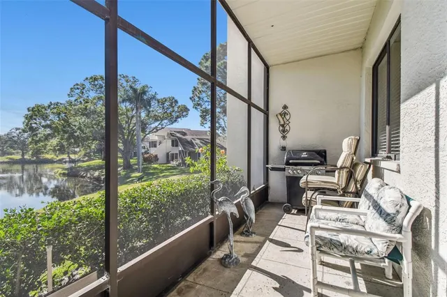 a view of a hallway with living room and furniture