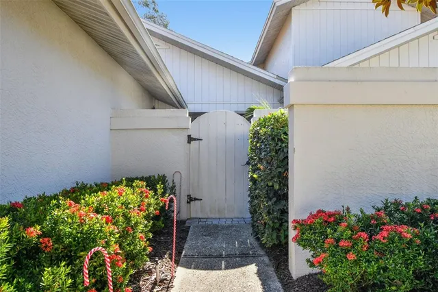 a vase with flowers on the floor of a house