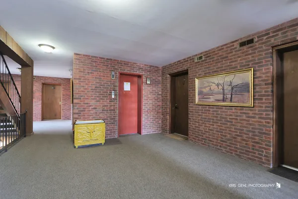a view of a livingroom with wooden floor and a couch
