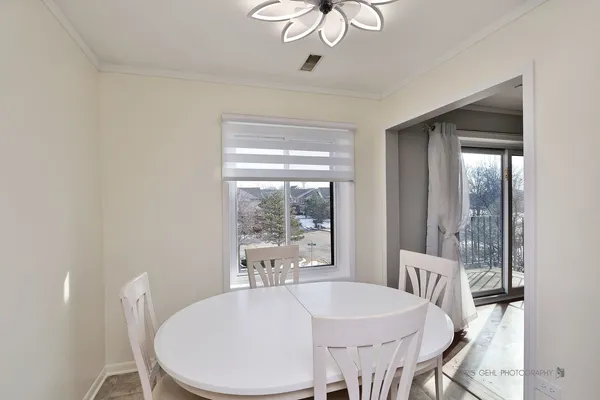 a view of a dining room with furniture window and outside view