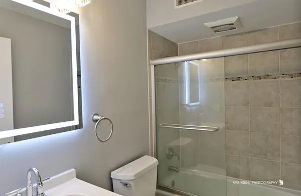 a bathroom with a shower and a toilet