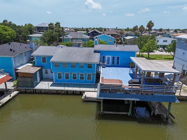 a view of balcony with table and chairs