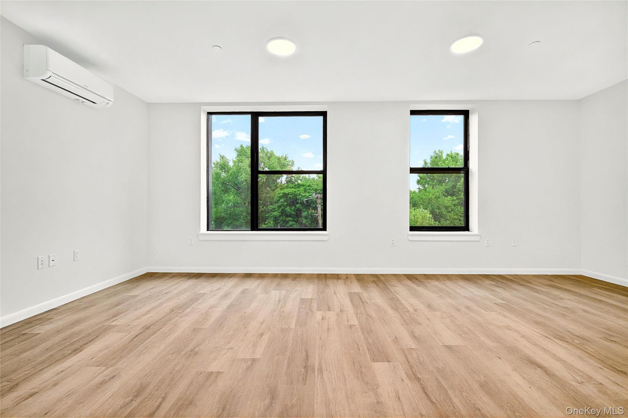 1731 Lacombe Avenue, Unit 4B Bronx, NY 10473 - Photo 10 of 29 Front living area with view to the front windows with view of the park