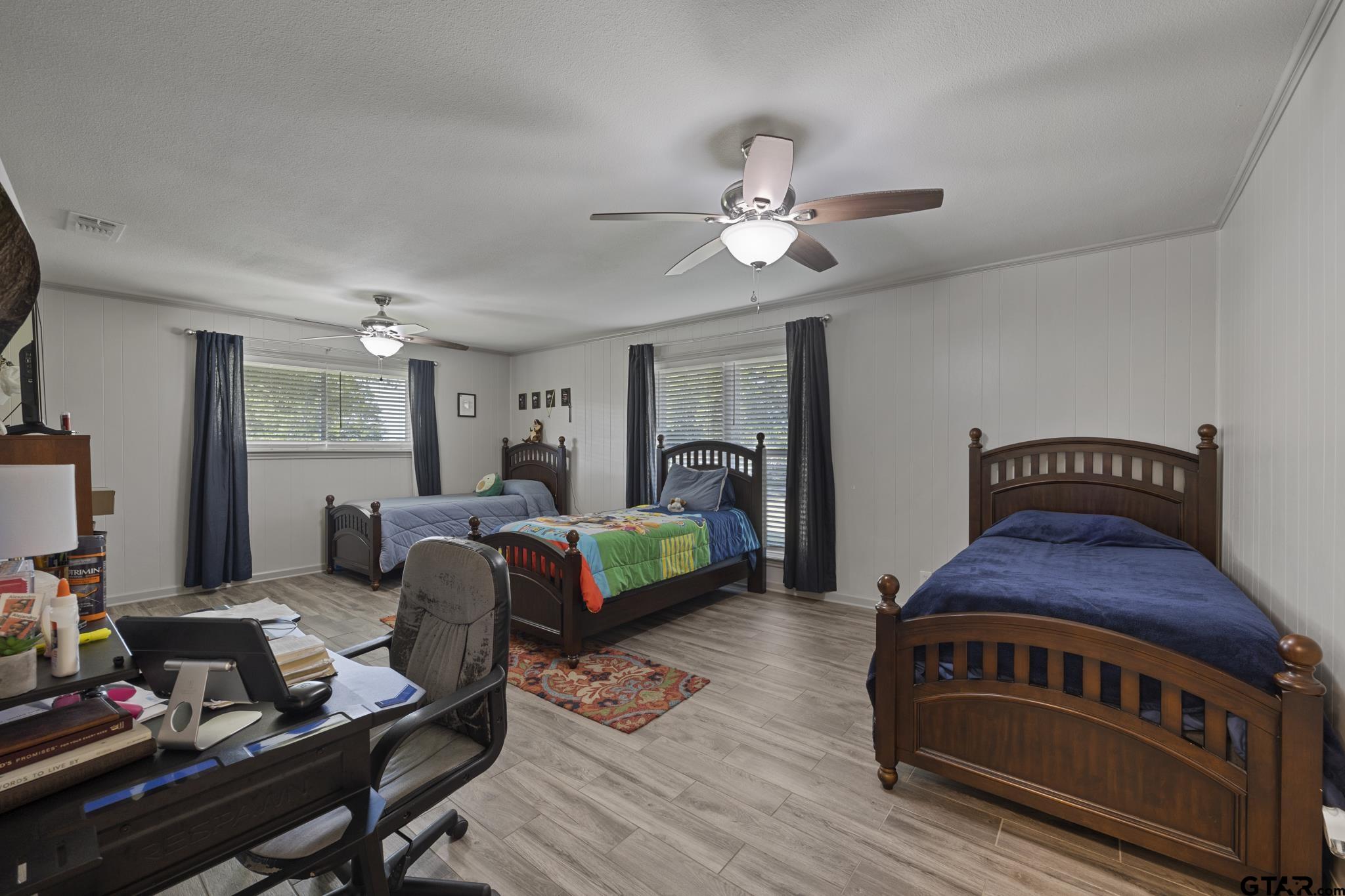 2201 Ridgley Tyler, TX 75703 - Photo 29 of 42 a bedroom with furniture and a wooden floor