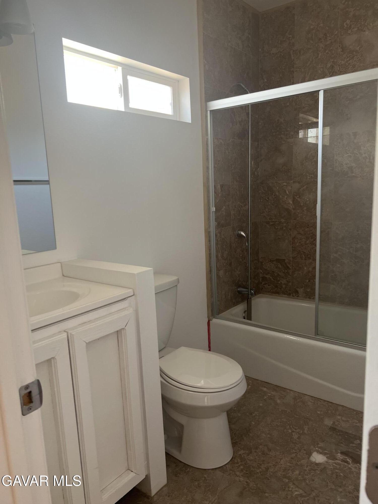 9241 East Ave R 14 Littlerock, CA 93543 - Photo 5 of 10 a white toilet sitting next to a bath tub