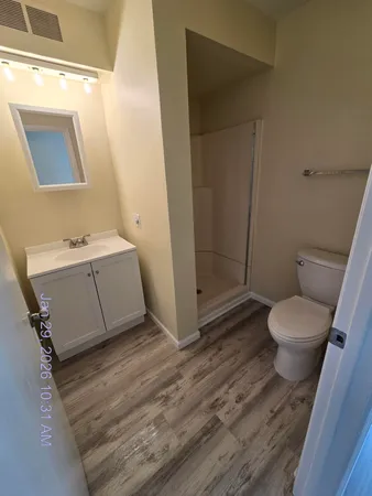 a view of staircase with white walls and railing