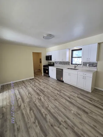 a kitchen with stainless steel appliances a stove and a refrigerator
