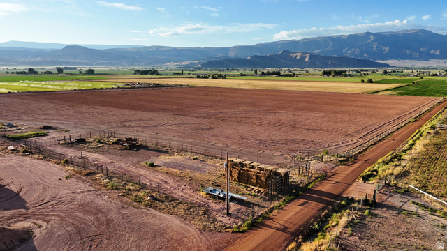 1000 East Mink Farm Road Richfield, UT 84701 - Photo 1 of 29 Expansive agricultural land featuring a tilled field and a dirt road