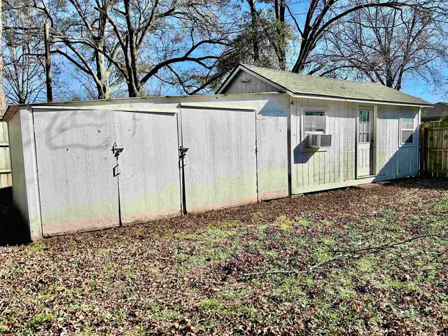 a view of a house with a tree