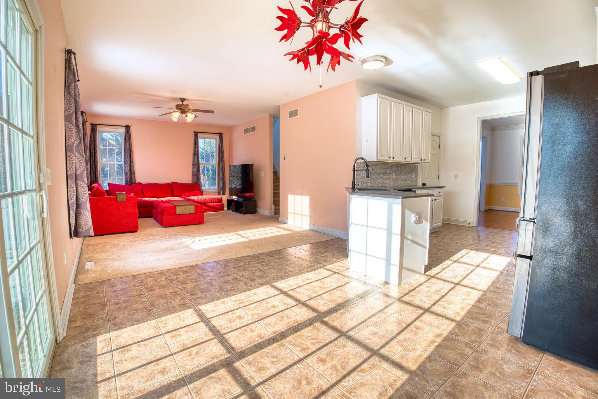 2412 Midstate Road Felton, DE 19943 - Photo 14 of 93 a kitchen with stainless steel appliances kitchen island granite countertop a refrigerator and a stove top oven
