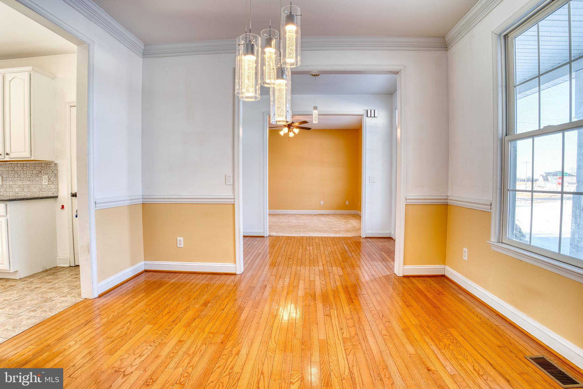 2412 Midstate Road Felton, DE 19943 - Photo 30 of 93 wooden floor in an empty room with a window