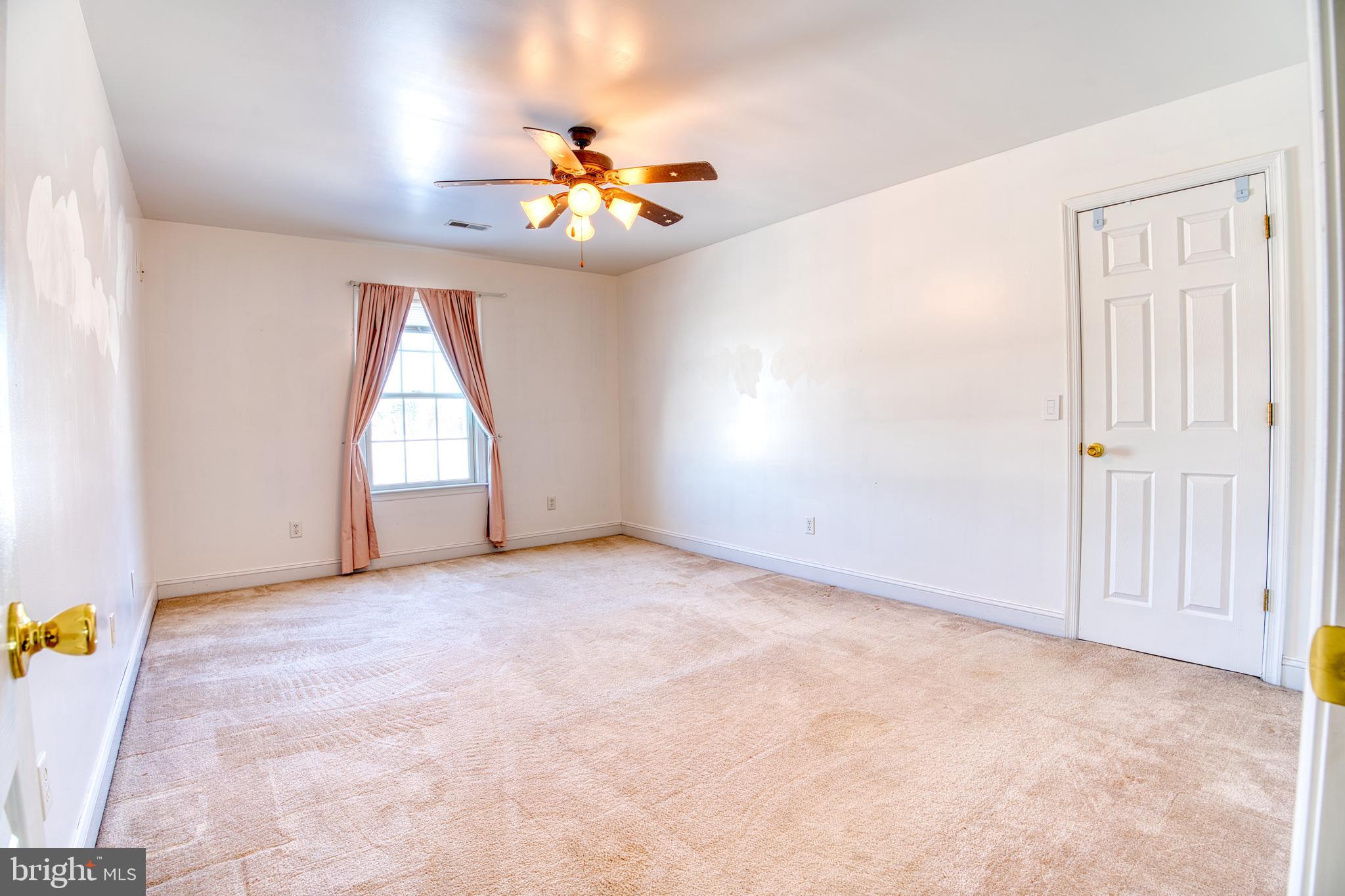 2412 Midstate Road Felton, DE 19943 - Photo 40 of 93 a view of an empty room with a window