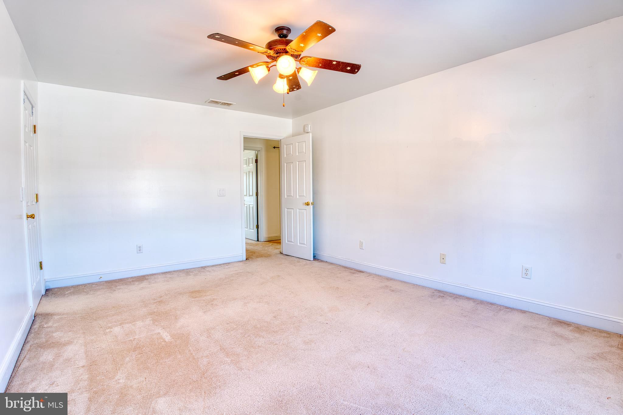 2412 Midstate Road Felton, DE 19943 - Photo 41 of 93 an empty room with a empty space and a ceiling fan