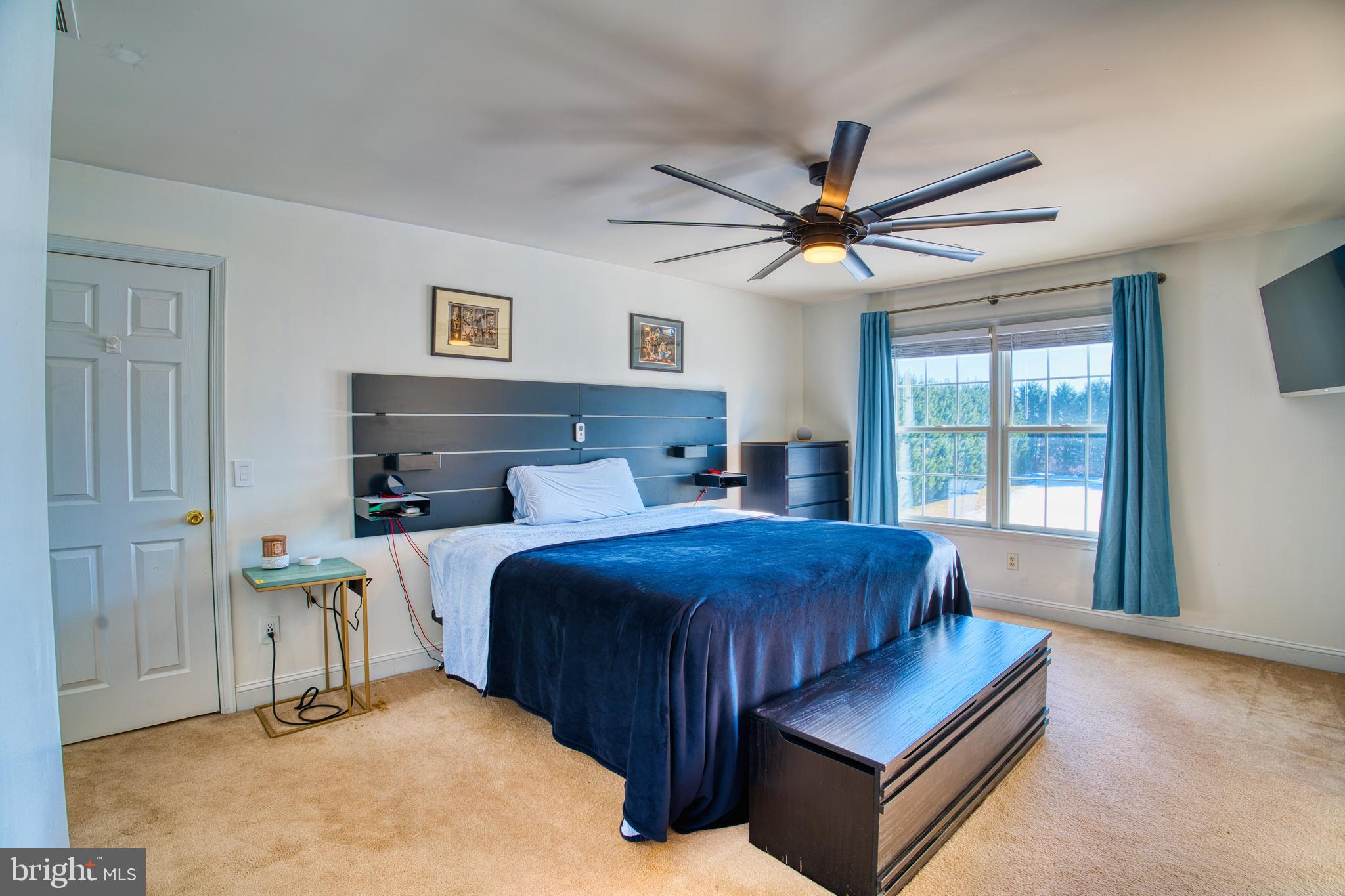 2412 Midstate Road Felton, DE 19943 - Photo 45 of 93 a bedroom with a bed and a chandelier