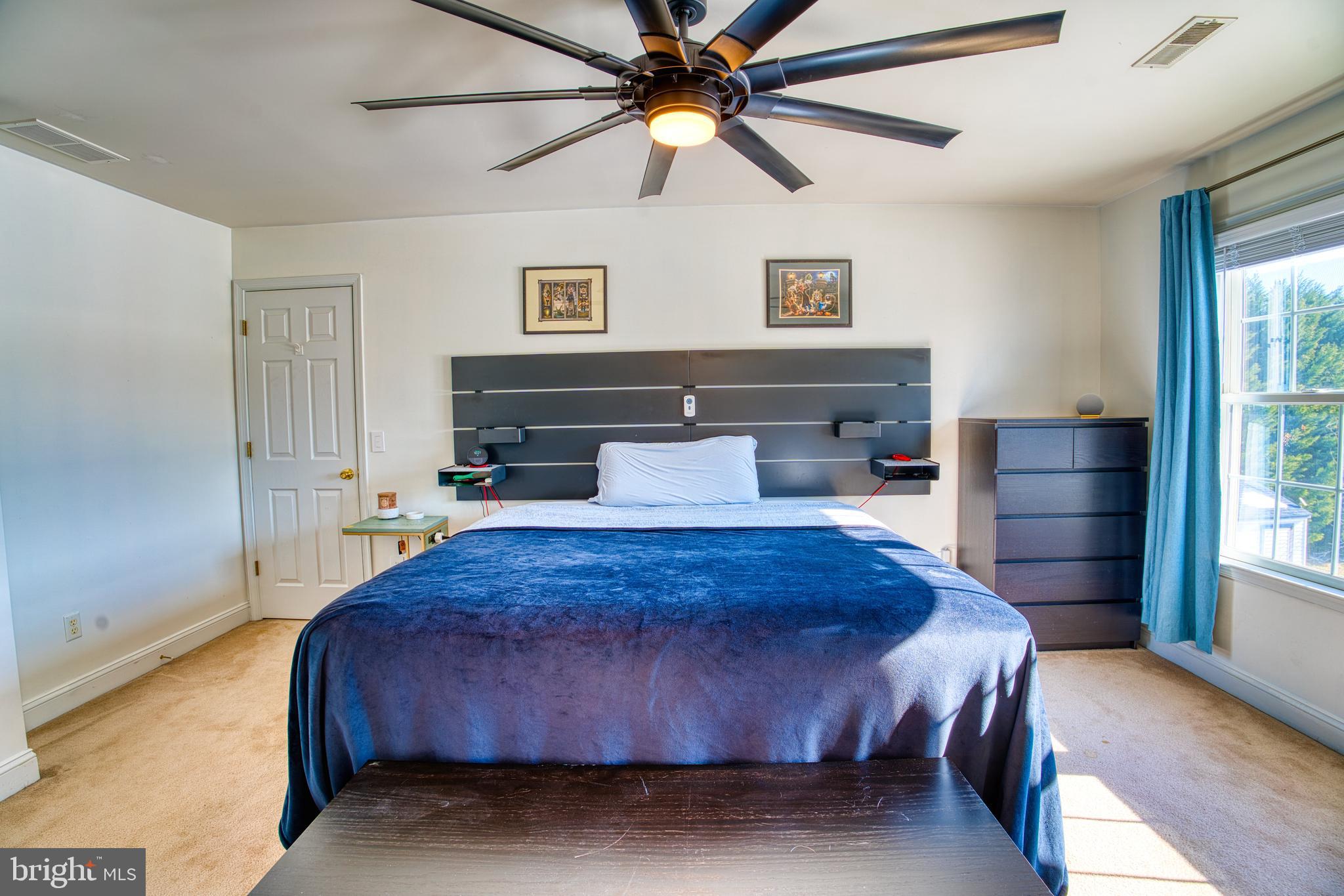 2412 Midstate Road Felton, DE 19943 - Photo 46 of 93 a bedroom with a bed and a chandelier