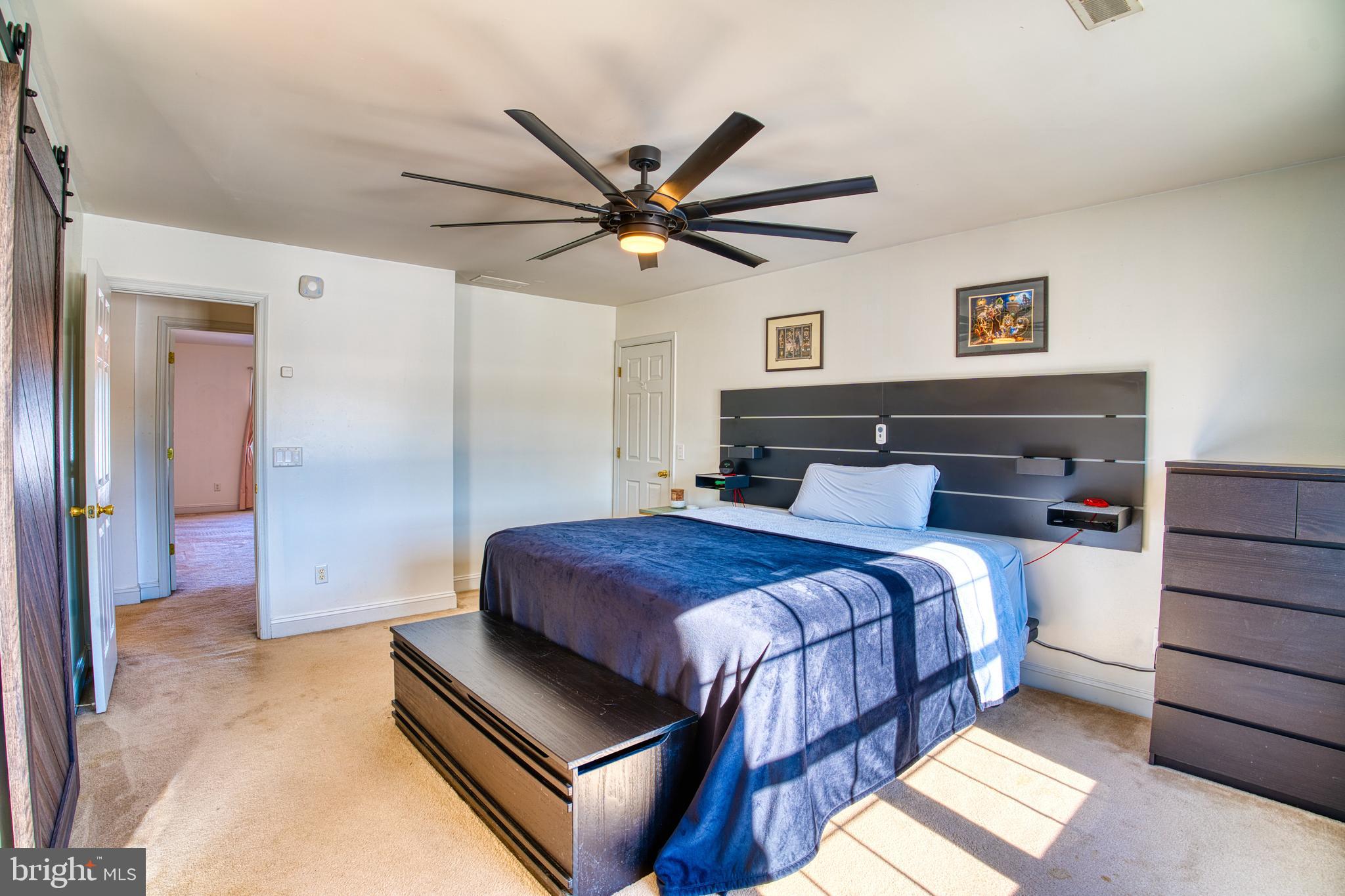 2412 Midstate Road Felton, DE 19943 - Photo 47 of 93 a bedroom with a bed and a ceiling fan