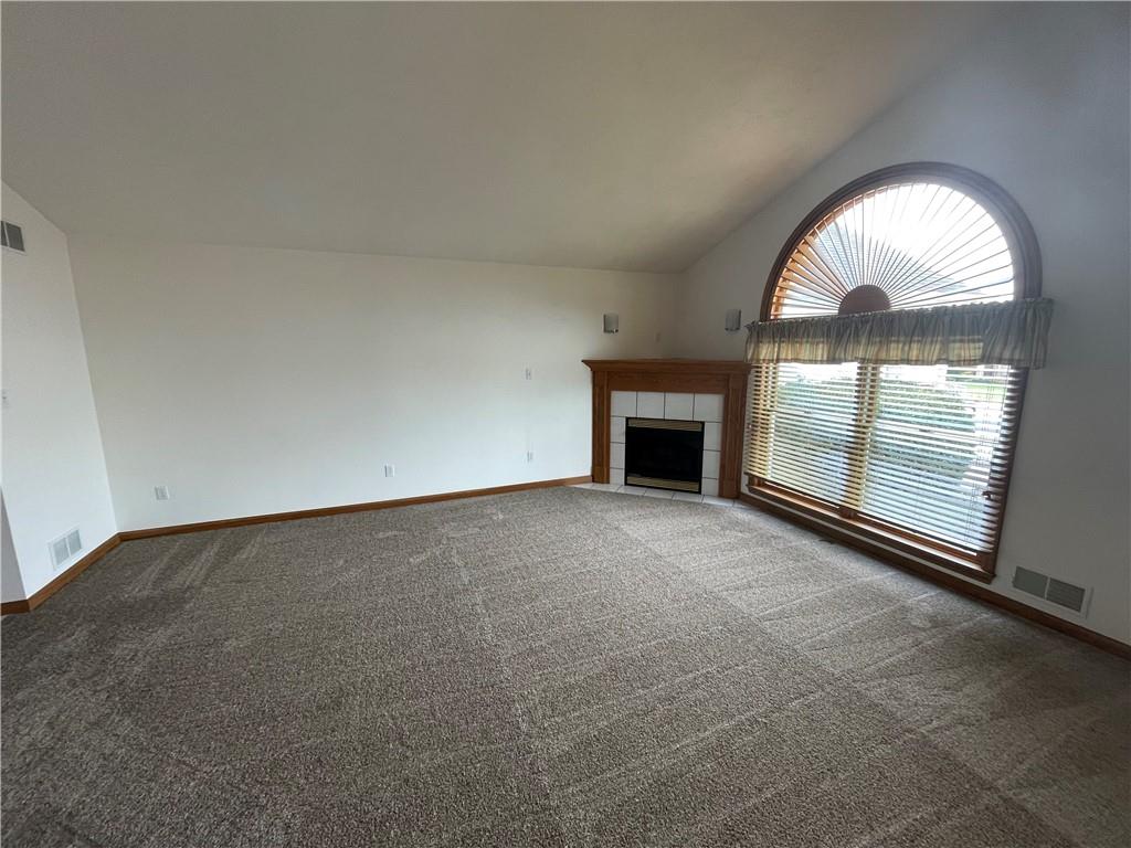 189 Huckleberry Road Indiana, PA 15701 - Photo 6 of 35 an empty room with large windows and fireplace