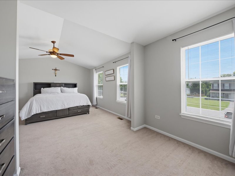 4201 Dillon Street Plano, IL 60545 - Photo 27 of 37 a bedroom with a bed and window