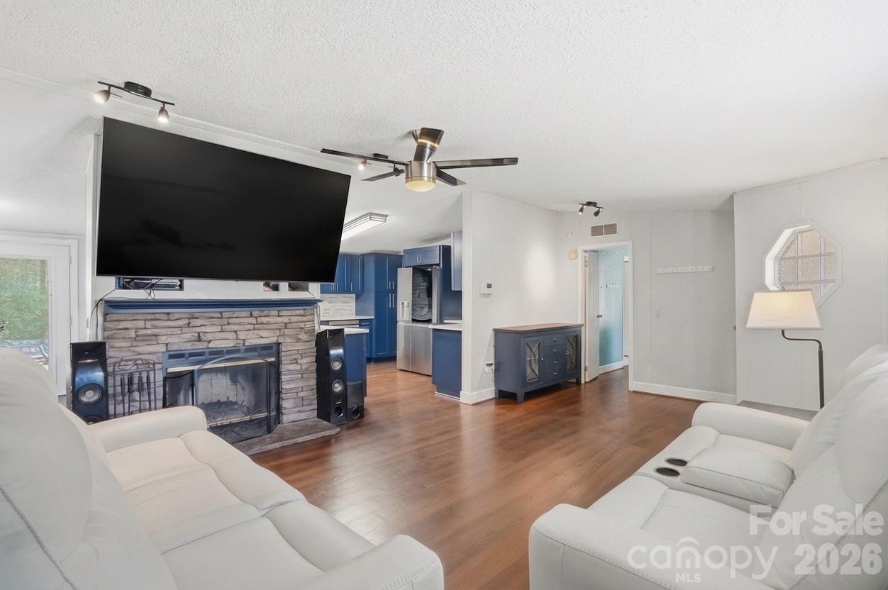 605 Ridgewood Court Mount Holly, NC 28120 - Photo 1 of 32 a living room with furniture fireplace and flat screen tv