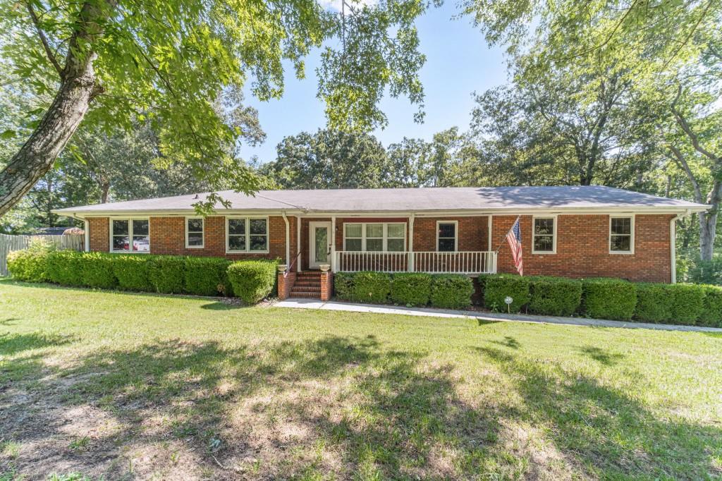 2955 Atkinson Road Loganville, GA 30052 - Photo 1 of 1 a view of a house with a yard and potted plants