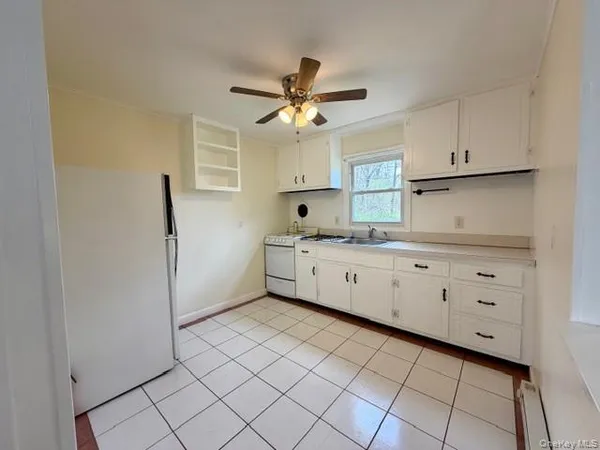 a kitchen with a cabinets and window