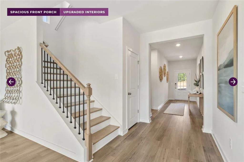 30 Poplar Blf Way Jefferson, GA 30549 - Photo 4 of 31 a view of a hallway with wooden floor and staircase