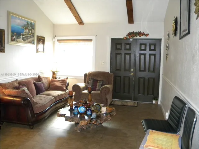 a bed room with a bed mirror and a desk