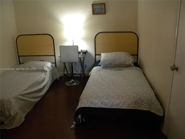 a kitchen with stainless steel appliances granite countertop a sink and a refrigerator