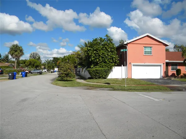a view of street and small yard