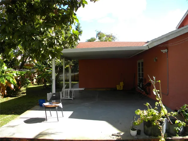a lobby with furniture and floor to ceiling window