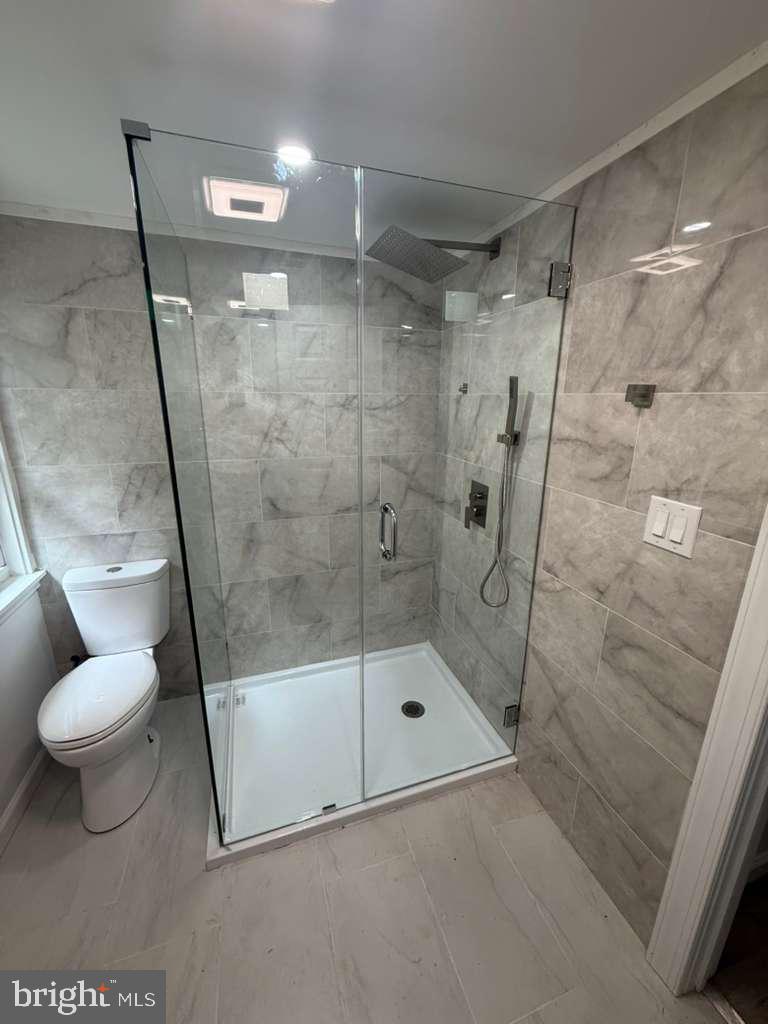 131 Schaeffer Hill Road Pottsville, PA 17901 - Photo 11 of 18 a bathroom with a shower and toilet