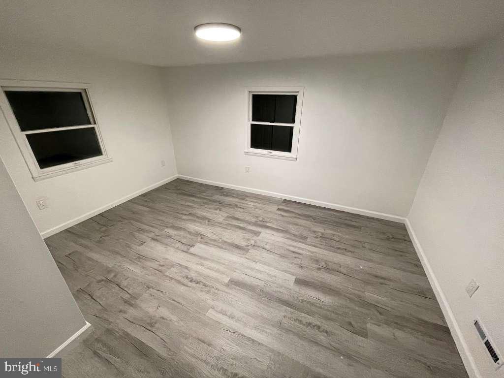 131 Schaeffer Hill Road Pottsville, PA 17901 - Photo 17 of 18 a view of empty room with wooden floor