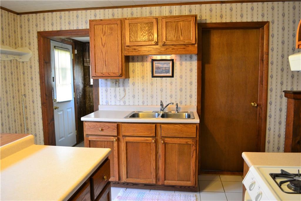 314 Main Street Richeyville, PA 15358 - Photo 14 of 25 Great kitchen with plenty of cabinets with a warm walnut finish and ceramic flooring.