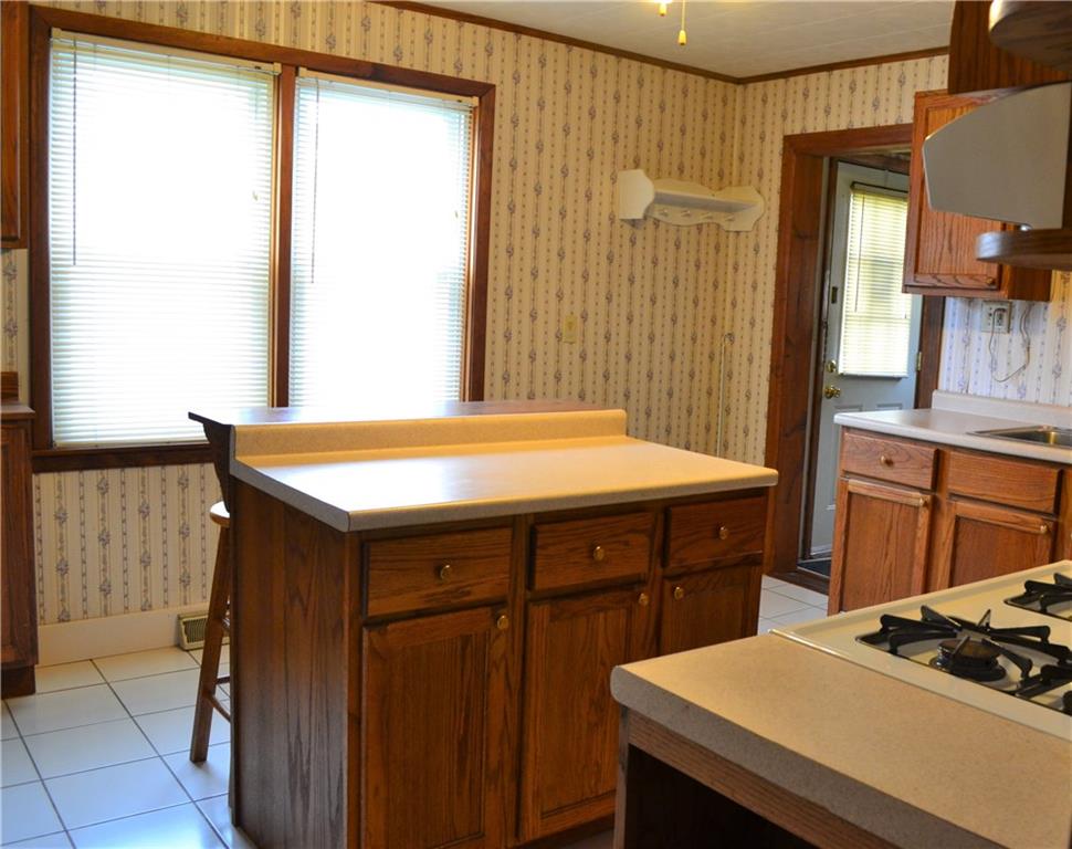 314 Main Street Richeyville, PA 15358 - Photo 16 of 25 Plenty of natural light throughout the home, The rear yard is accessed through from the small mud room off the kitchen.