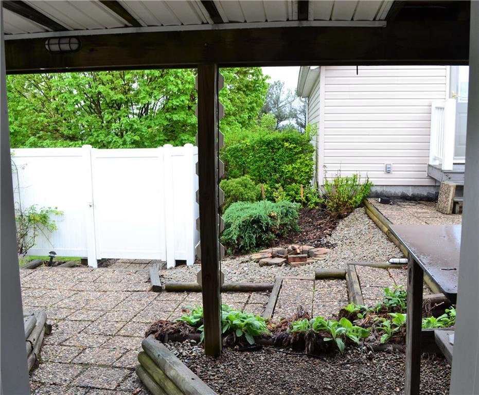 314 Main Street Richeyville, PA 15358 - Photo 25 of 25 Walk out access from the laundry area to the rear courtyard- enclosed with high vinyl fencing providing privacy.