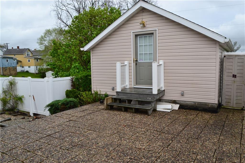 314 Main Street Richeyville, PA 15358 - Photo 7 of 25 Super cute courtyard/patio connects the home and the upper level over the garage.