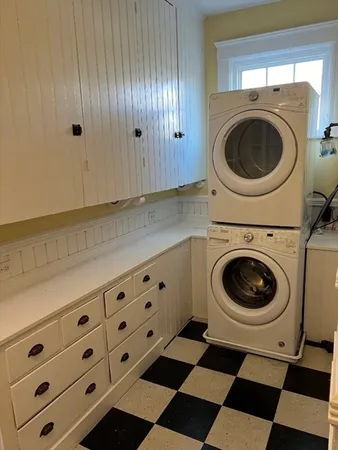 a view of a storage and utility room with washer and dryer