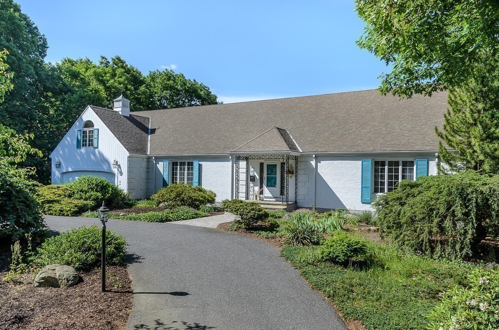a aerial view of a house with a yard