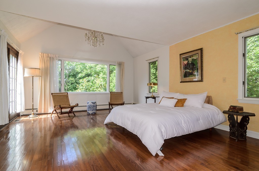 22 Cranmore Road Wellesley, MA 02481 - Photo 12 of 22 a bedroom with a bed and large windows