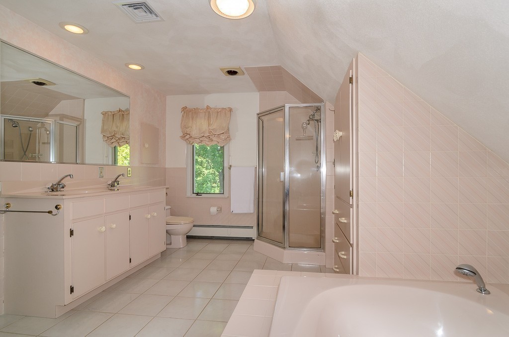 22 Cranmore Road Wellesley, MA 02481 - Photo 15 of 22 a spacious bathroom with a bathtub sink and mirror