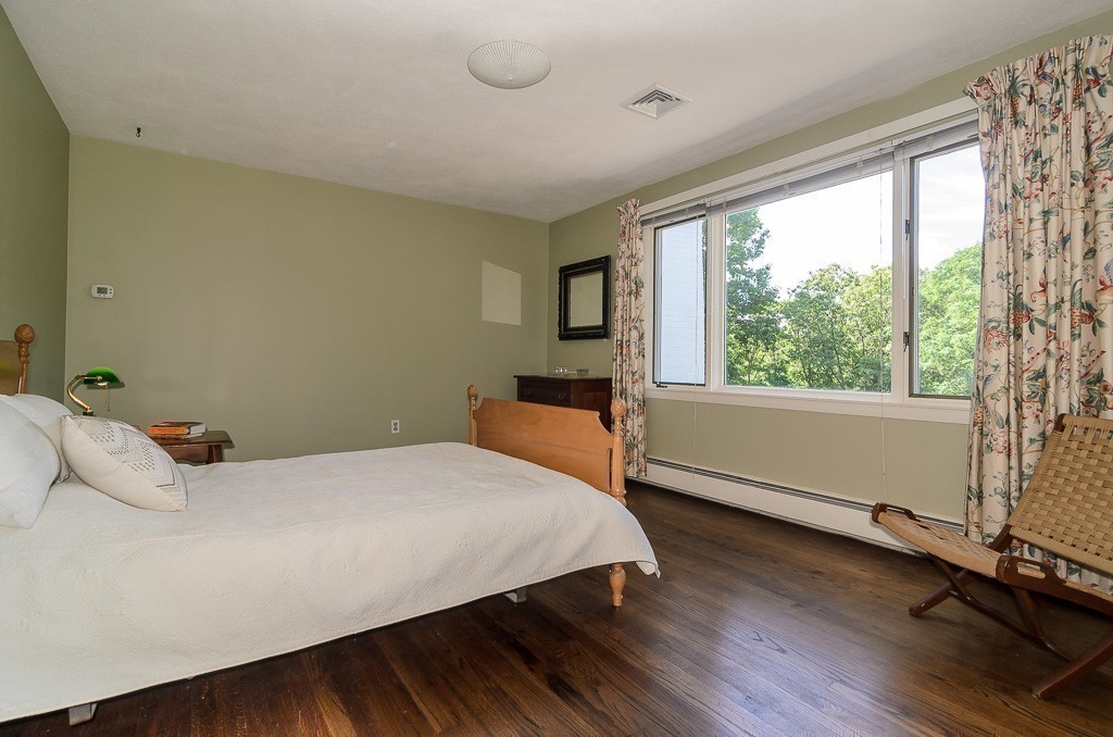 22 Cranmore Road Wellesley, MA 02481 - Photo 16 of 22 a bedroom with a bed and wooden floor
