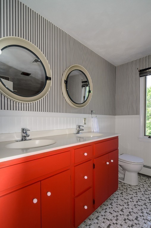 22 Cranmore Road Wellesley, MA 02481 - Photo 18 of 22 a bathroom with a toilet a sink and mirror
